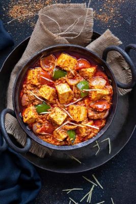  Kadai Paneer: Une symphonie épicée de fromages indiens grillés et d’une sauce tomate onctueuse!