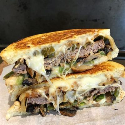  Le Philly Cheesesteak : Une Symphonie de Fromage Fondant et de Viande Grillée à la Perfection !